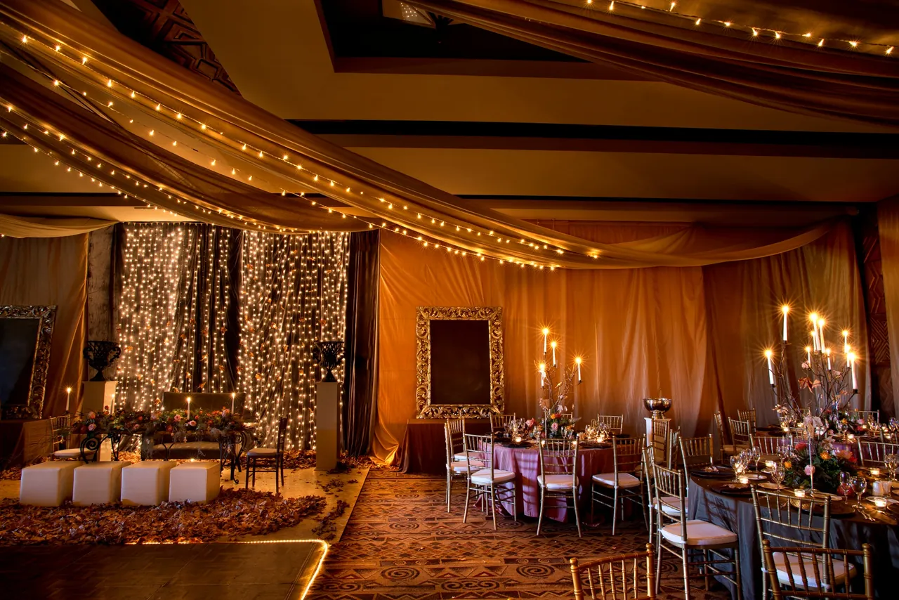 A banqueting room at the resort set with round tables for a dinner